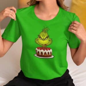 Women's Holiday T-Shirt with Unique Christmas Grinch Ready to Eat a Fruitcake Design.