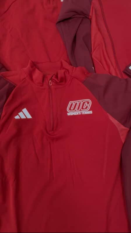 Red athletic apparel featuring UIC Women's Tennis logo and Adidas branding.