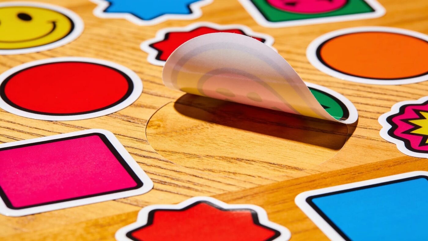 High-quality custom vinyl stickers displayed artistically, showcasing vibrant colors and die-cut features for custom sticker printing
